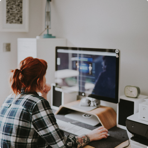 Woman with red hair working from home